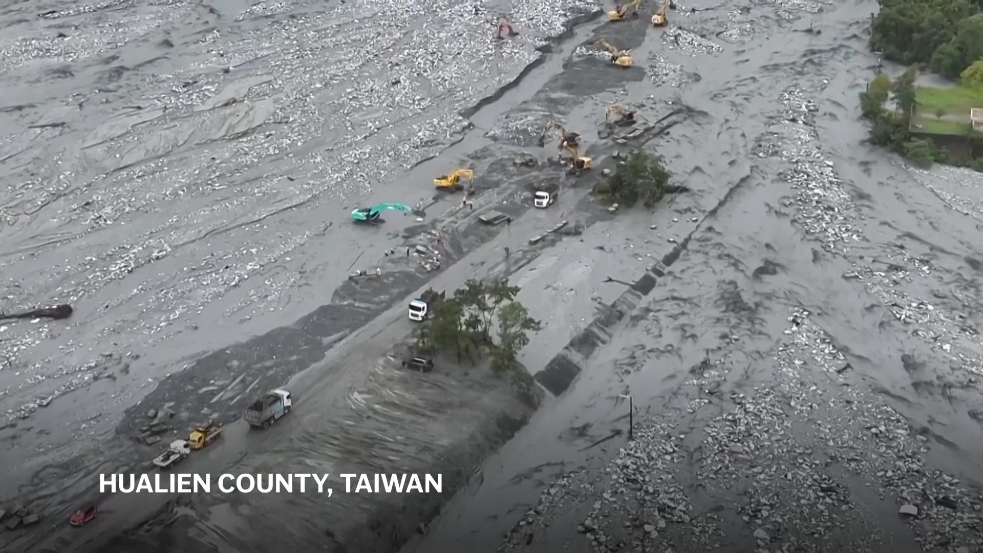 River floods and house collapses in heavy rain as tropical storm nears Taiwan