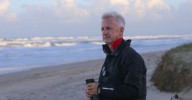 Professor Thomas Schlacher was forced to flee Australia after calling to ban 4WDs on some parts of the beach