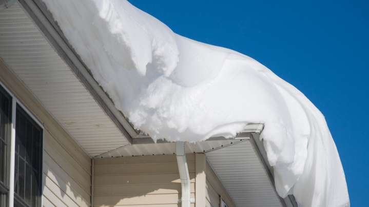 The Handy Tool That Helps Clear Snow Off Your Roof And Gutters