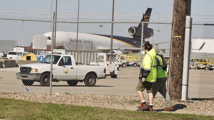 Search for victims, answers continues at site of UPS plane crash