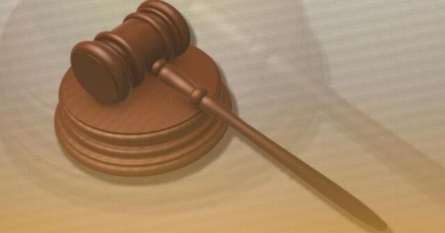 The man who threw a sandwich at a federal agent says it was a protest. Prosecutors say it's a crime