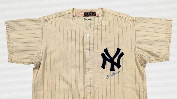 Yogi Berra's rookie jersey, perfect game pants top $550K at auction