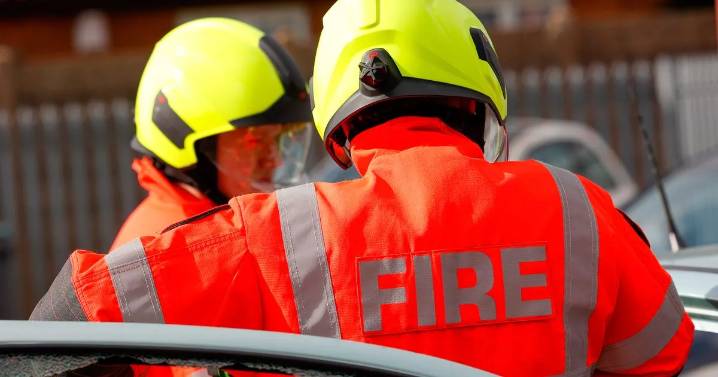 Firefighters battle blaze at house on residential street in Ashford