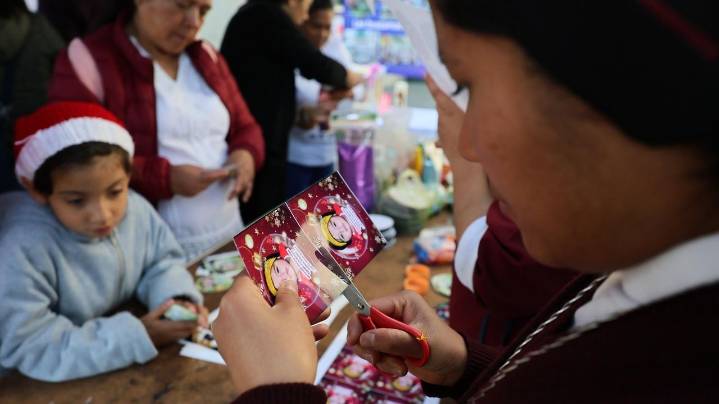 A Christmas tree in Mexico carries the faces of loved ones who never came home