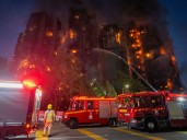 Three arrested in Hong Kong as tower blocks fire leaves at least 44 dead