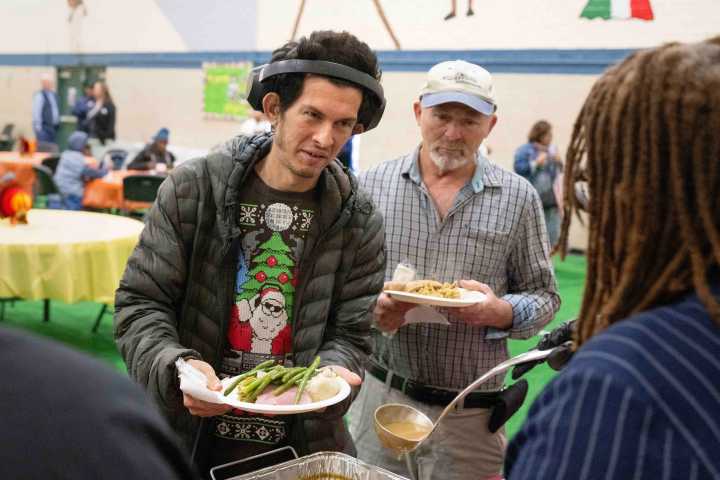 Long Beach residents share a warm meal at the annual Thankful Heart Thanksgiving event