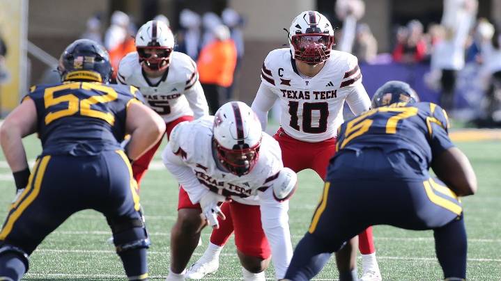 Morton throws for 3 TDs, LB Rodriguez scores on offense again and Texas Tech whips WVU 49