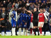 Ten-man Chelsea battle for a point against leaders Arsenal in fiery derby