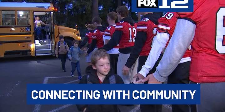 Oregon City HS football team starts Fridays with elementary school visits