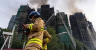 Firefighters continue to tackle deadly Hong Kong tower blaze