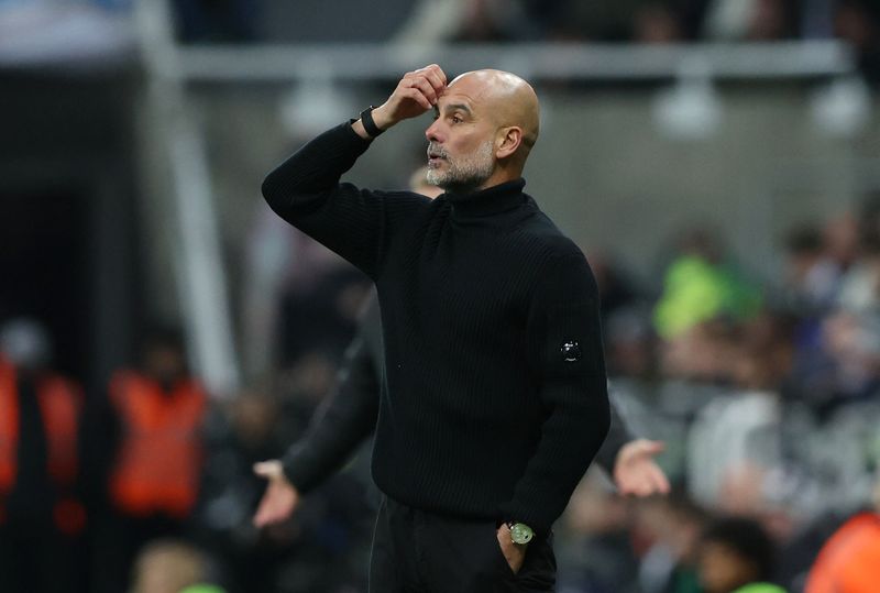 Soccer-Man City’s Guardiola apologises for confrontation with cameraman