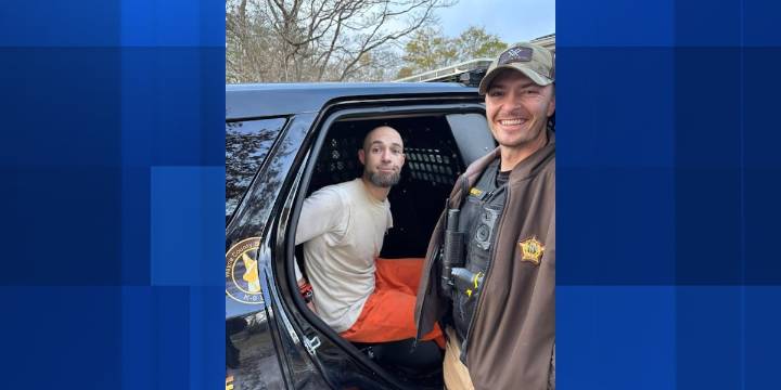 Police take escaped inmate into custody