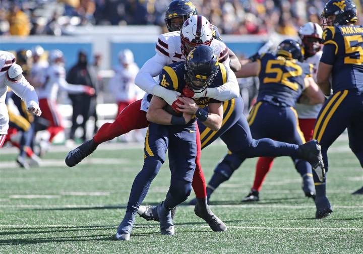 Rich Rodriguez's 1st season back at West Virginia ends with shutout loss to Texas Tech