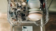Why Your Dishes Smell Funky After Going Through The Dishwasher