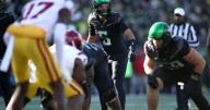 Moore throws 2 TD passes and No. 6 Oregon derails No. 16 USC's CFP hopes with a 42