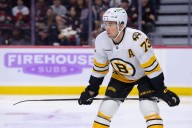 Bruins' Charlie McAvoy injured vs. Canadiens after taking slap shot to the face
