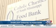 Sparklight donates $1,500 to Catholic Charities of South Mississippi Food Bank.