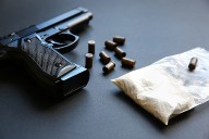 Mastic Man Charged with Possessing Narcotics and Loaded Firearms