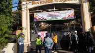 Multiple explosions shake a mosque in an Indonesian high school and injure 55