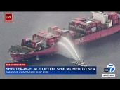 Ship is moved out to sea from Port of LA after fire erupts onboard; shelter