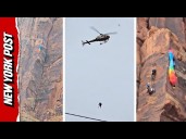 Helicopter Makes Incredible Maneuver to Rescue BASE Jumper Dangling From Canyon Wall