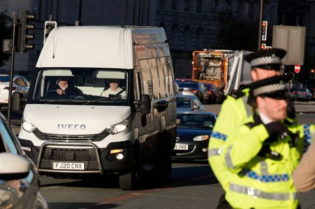 Liverpool parade crash suspect Paul Doyle wipes away tears as he appears in court facing 31 charges