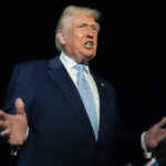 Trump defends Tucker Carlson after interview with activist known for his antisemitic views