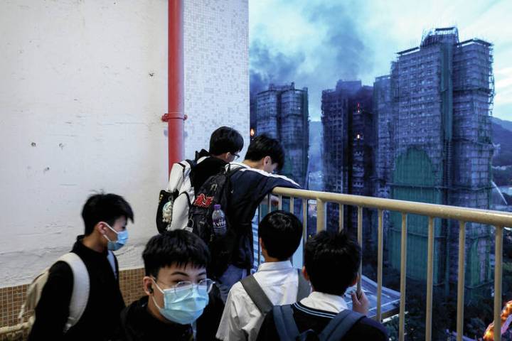 Hong Kong police arrest construction firm bosses over fire; death toll hits 83 with scores missing