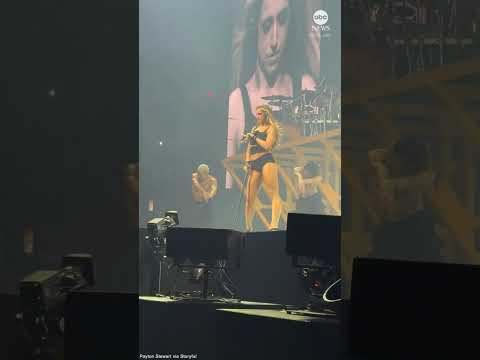 Pop star spotted singing into upside