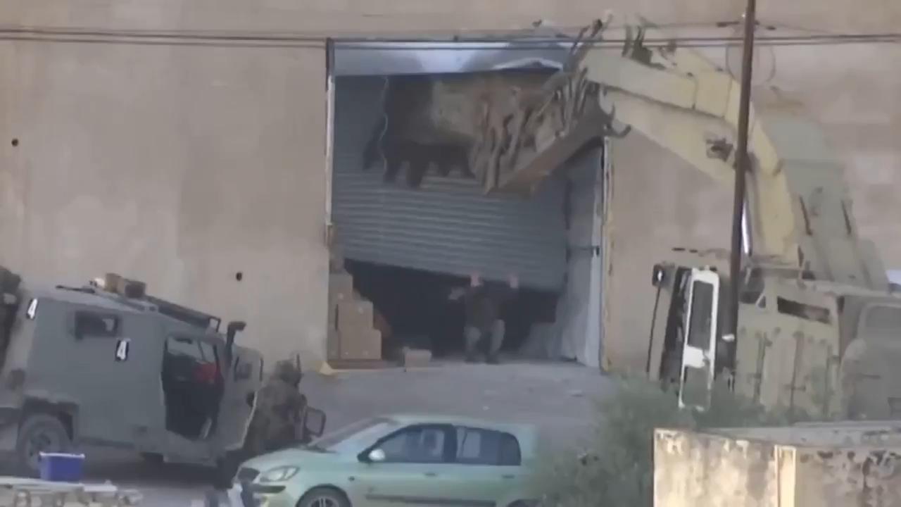 Israeli forces kill two Palestinian men in occupied West Bank after they appear to surrender to troops