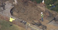 Cleanup underway in Westford after water main break floods homes, collapses road