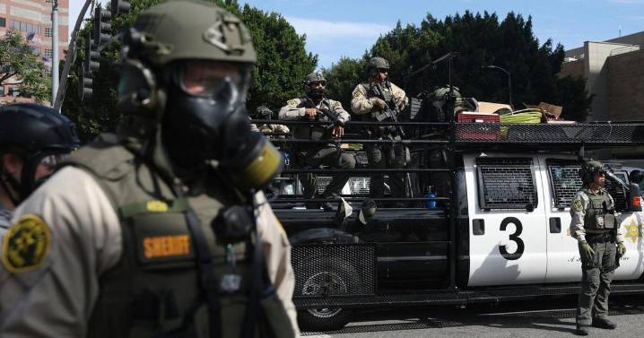 Trump administration sues California over law banning masked federal agents