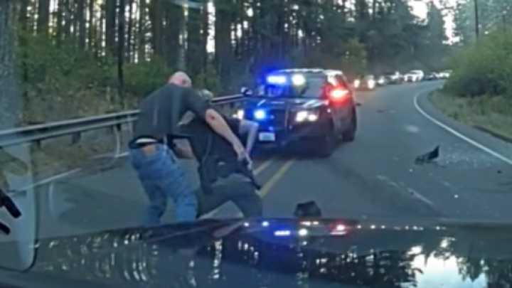 Video: Man attacks Wash. SRO who stopped to help at crash, tries to grab her gun