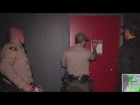 Authorities go door to door to check residents in evacuation zones