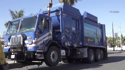 Woman decapitated in garbage truck crash while crossing street in Santa Ana, police say
