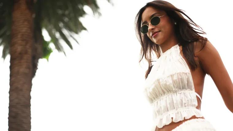 Newly-engaged WAG stuns in low-cut leather dress