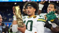 Love matches career high with four TD passes, lifting Packers to win over Lions