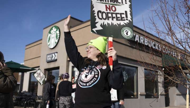 Starbucks workers kick off 65-store US strike on company’s busy Red Cup Day