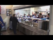 Salvation Army volunteers prepared warm Thanksgiving meals to give away to the homeless