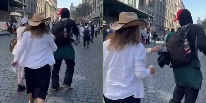 Señora en la marcha de la Gen Z “bendice” a un encapuchado del Bloque Negro, grupo que agredió policías en Palacio Nacional