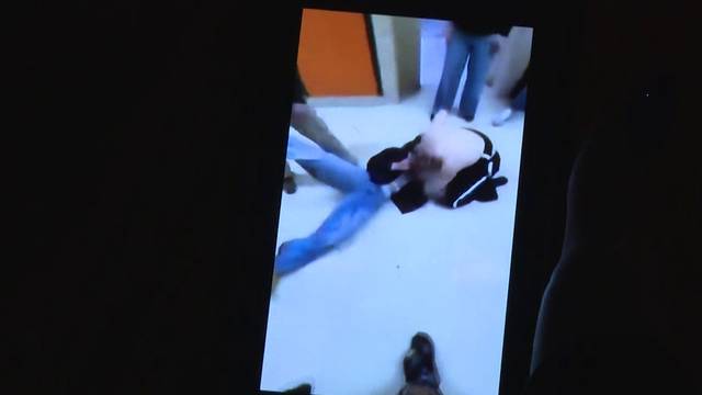 Video shows student swing metal mug during Mass. high school fight