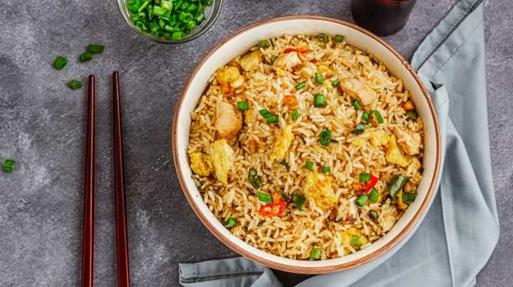 Unlock Fried Rice's Inner Umami Instantly With Just A Few Dashes Of This Liquid