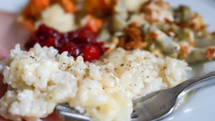 Cheesy baked rice is a can't miss Thanksgiving side dish