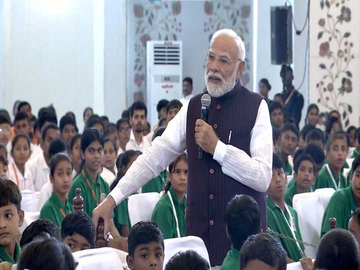 PM interacts with children, emphasises maintaining good health