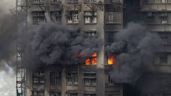 At least 75 dead as Hong Kong firefighters battle burning towers for a second day