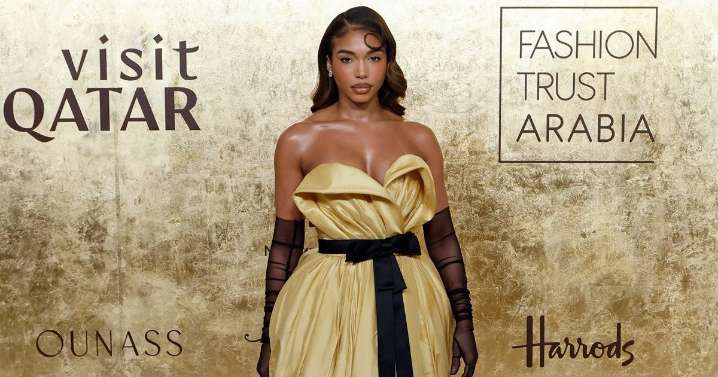 Lori Harvey Wearing Thigh-High Slit Dress Demands Second Glance