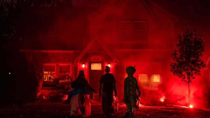 See trick-or-treaters in Des Moines' Waveland Park neighborhood