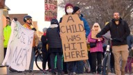 Winnipeggers rally at intersection where boy was hit by car while crossing street on bike