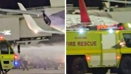 Brisbane Airport: Fire breaks out as Virgin Australia plane lands