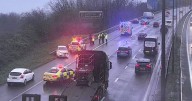 M4 closed after two crashes as four-vehicles collide and one person cut from a car